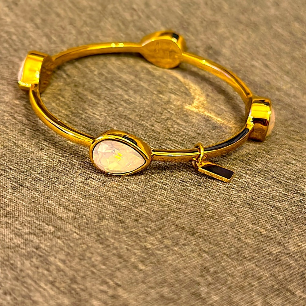 COACH women’s bangle with iridescent opal type gem gold